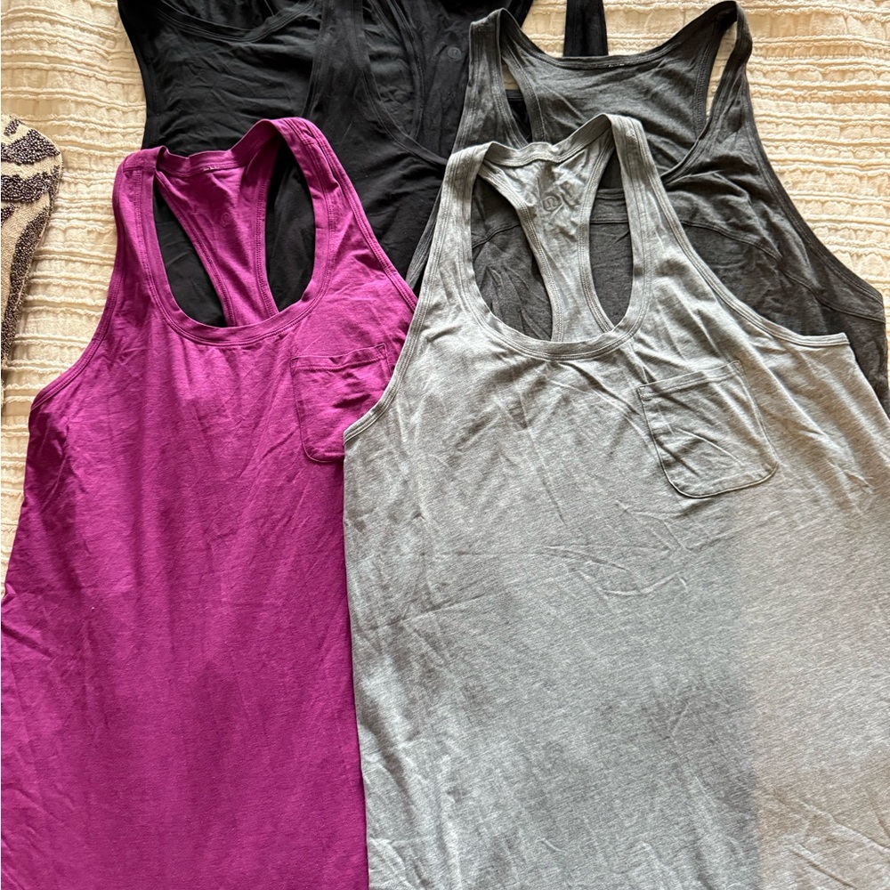 EUC Lot Bundle (5) of Lululemon various tanks.  Sizes 8-10. Gray/black/purple